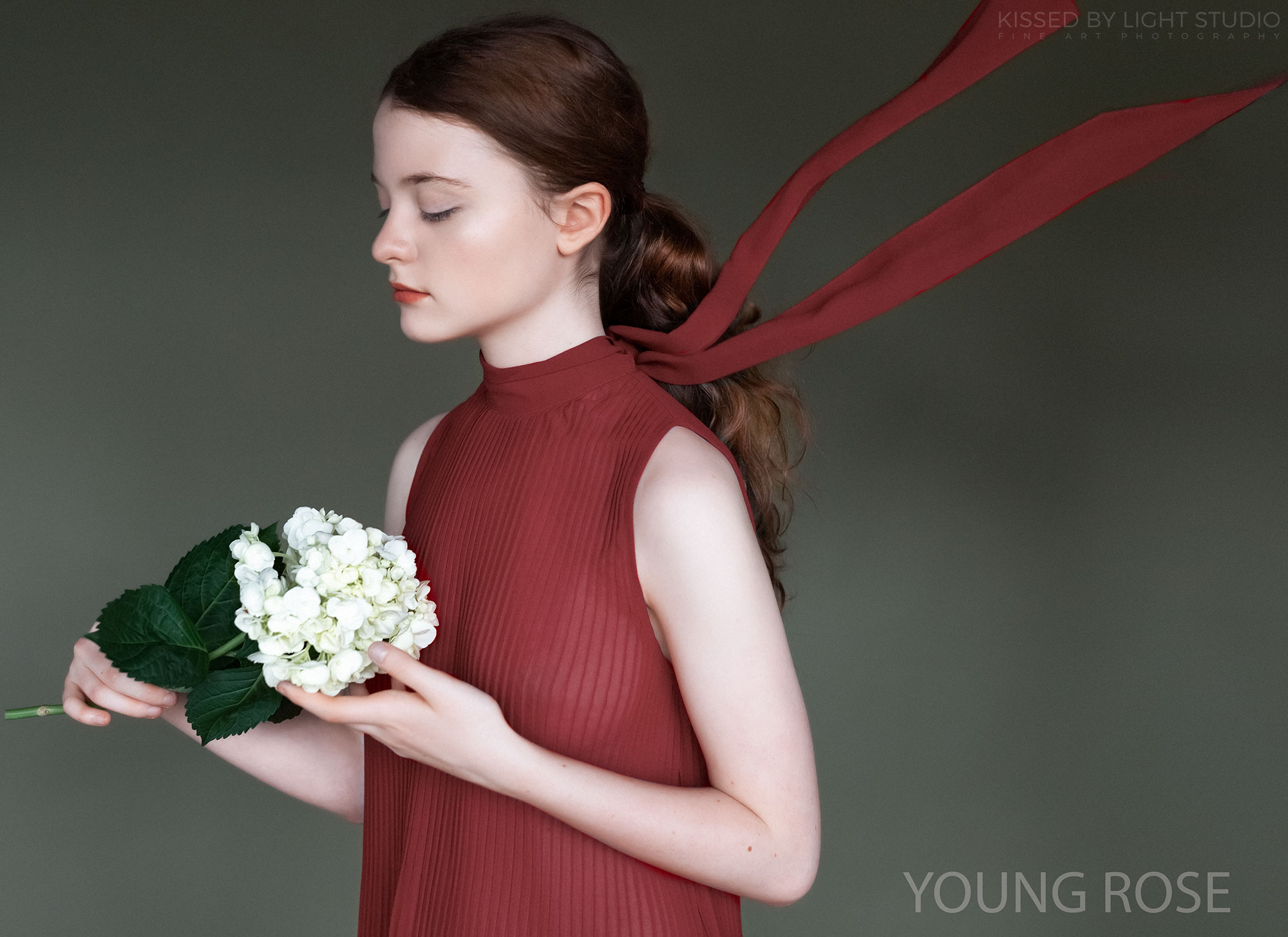 Fashion portrait of young girl with flowers