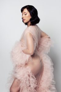 classy, vintage style outfit and photography, short brunette hair in pink fluffy outfit