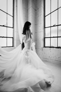 Black and white classy bridal boudoir photography, long white beautiful wedding dress