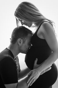 Beautiful contemporary black and white photography, nude maternity, classy, elegant, black and white photographer, couple pregnancy photos, silhouette, kissing her pregnant belly