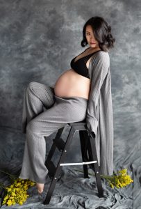 Stunning artistic maternity photoshoot, Toronto, grey suit set, florals