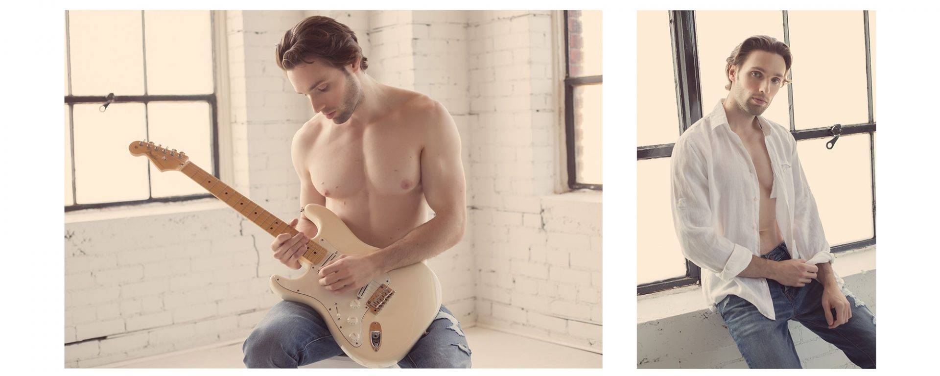 A man's portrait, he is playing his guitar shirtless.