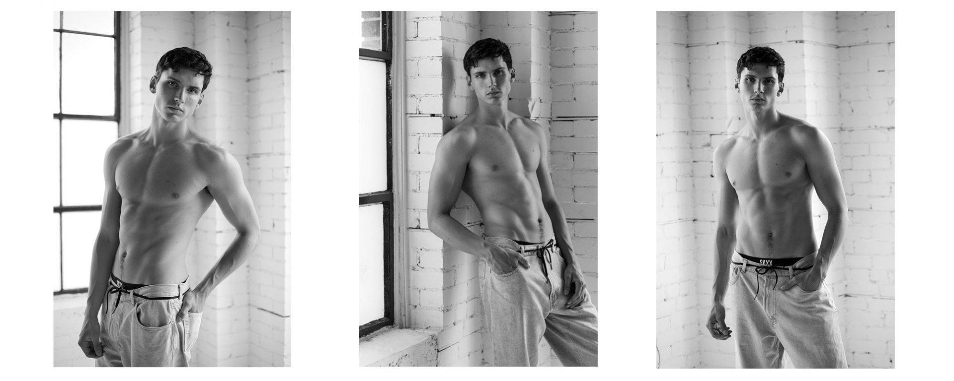 Shirtless male model posing for a professional photography studio.